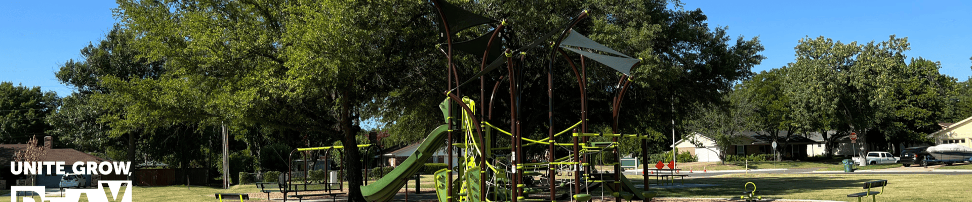 Photo of Bowling Green Park with white parks and recreation logo on the bottom left corner