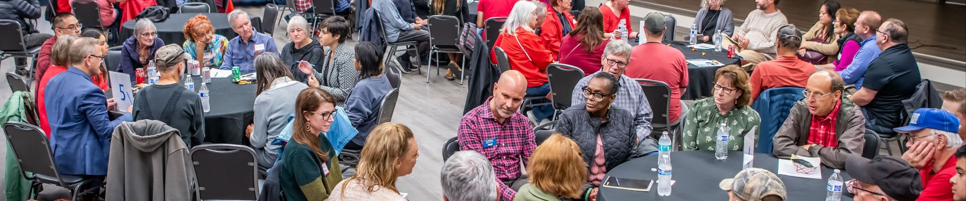 Community members take turns sharing around tables, as part of a Council Community Forum at the Luepke Community Center.