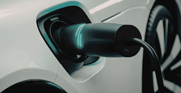 Electric car plugged into a charging station. 