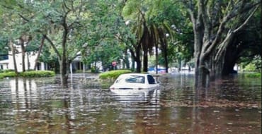 Car in flooded Parkland Estates neighborhood in 2015