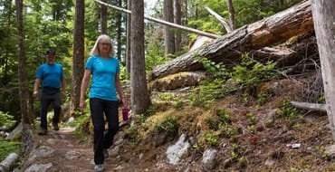 a couple walk on a trail in the Shuswap