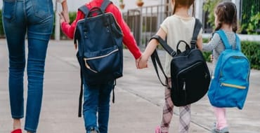 Children and parent walking
