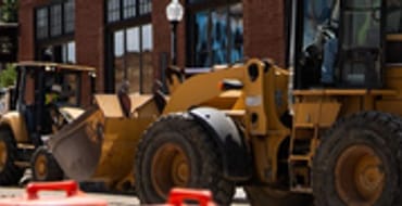 Road construction downtown with work truck
