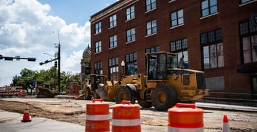 Road construction downtown with work truck