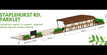 Image of parklet, which plants and shelter