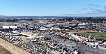 Large planes and crowds at the airport during the airshow