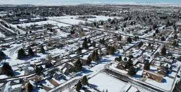 A drone image of Laramie residential buildings in Winter. 