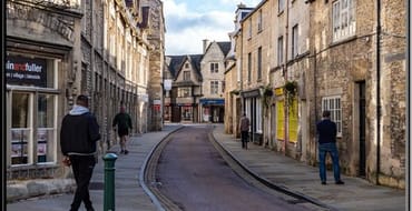 Image of street with shops and houses