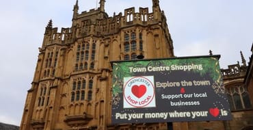 Image of sign about town centre shopping and supporting local,  Credit LPA Photography