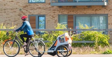 Cyclist with attached trailer