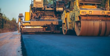 Construction truck laying concrete