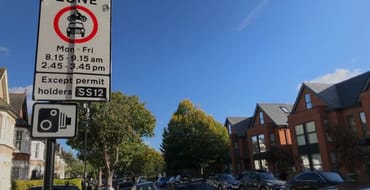 School Street sign and cars in background