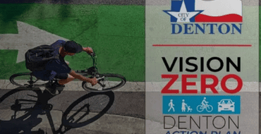 image of person on bike with Denton Vision Zero Logo