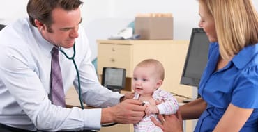 Image of a doctor, baby and mother