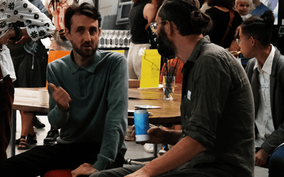 A diverse crowd of people connecting with each other at Blue Garage maker space in Lewisham