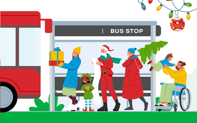 Picture of people getting on red bus with Christmas theme