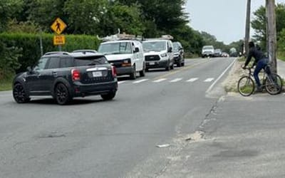 Image of Surfside Road with the all way stop sign and cars.