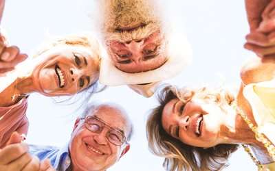 Group of older people men and women in a huddle