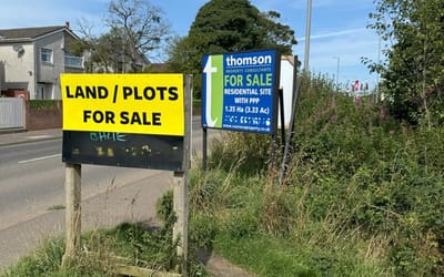 Image of boards advertising land for sale in Kilwinning