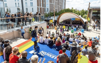 People watching and listening to the choir in Bond Square, Bracknell