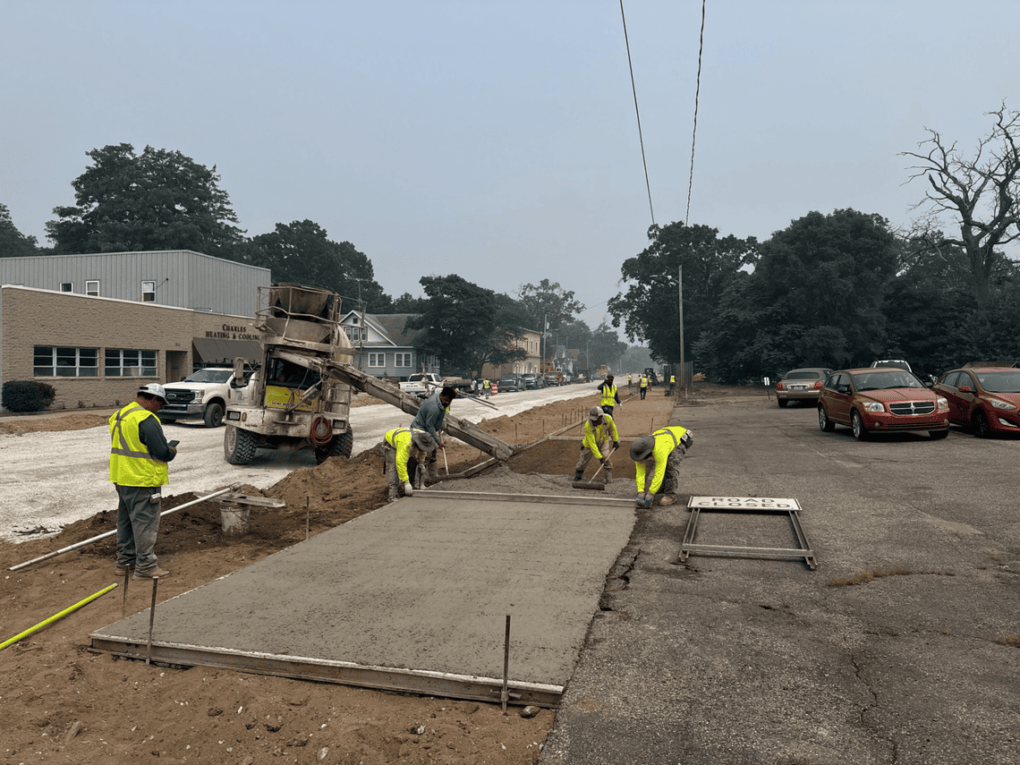 New Sidewalk Being Poured near Wood St, Looking East