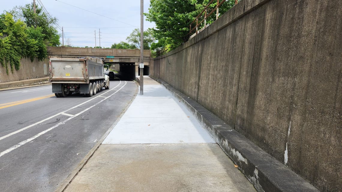 New sidewalk on the Henderson Dr. underpass