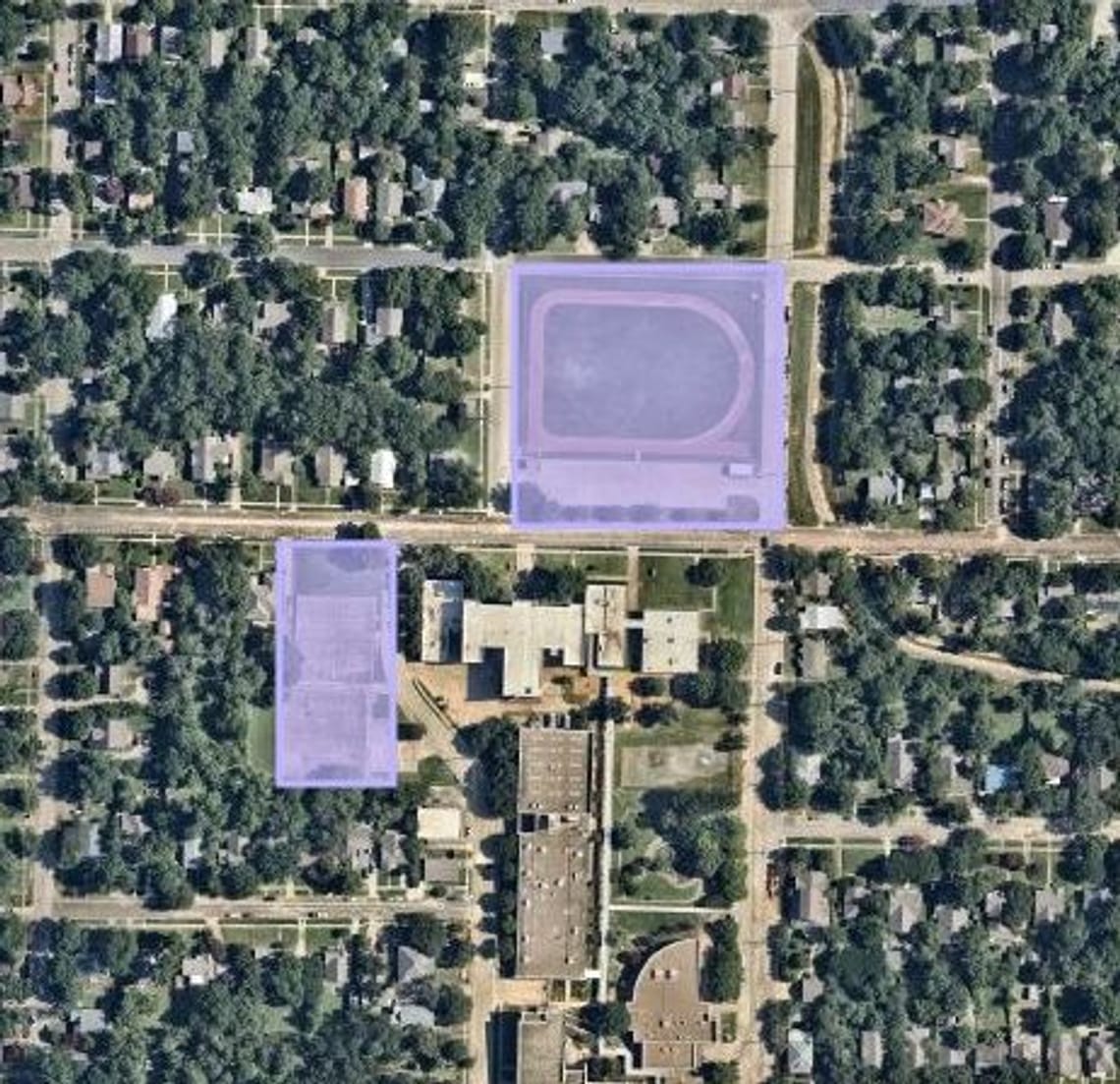 A zoomed in aerial image clearly showing the two sections or park land - the north track and field and the west tennis courts.