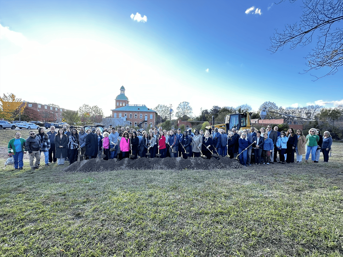 Group photo of attendees at the groundbreaking ceremony for the Pilgrim's Sanford Agricultural Marketplace.