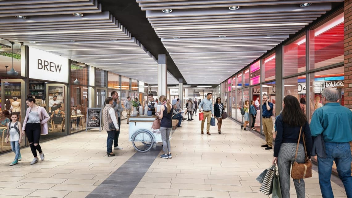 Interior of the shopping centre with shops on either side 