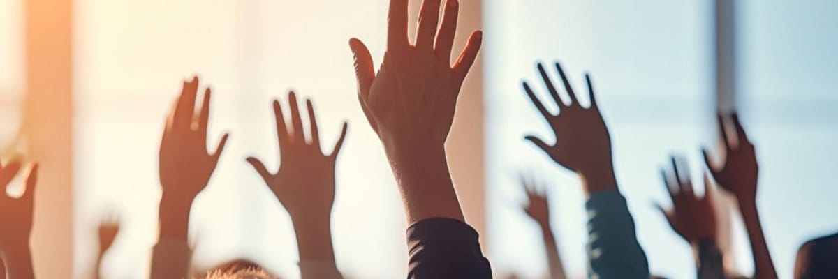 hands raised in meeting