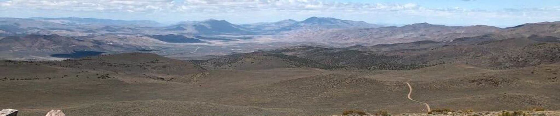 North west Pond Peak landscape view, overlooking Warm Springs & Rural area, with bike mid screen.
