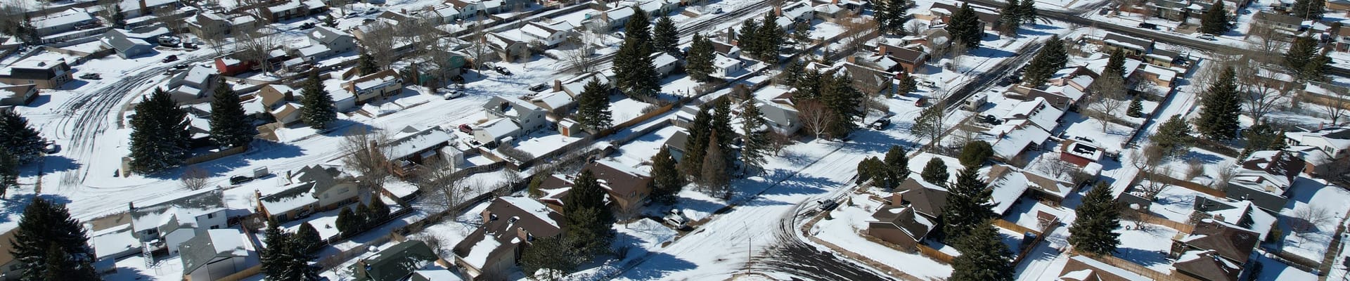 A drone image of Laramie residential homes in Winter.