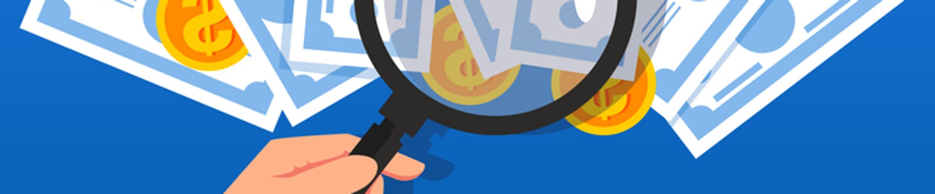 Magnifying glass over a pile of cash