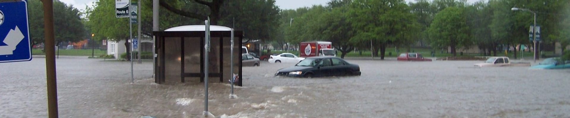 Flooding with cars stuck in high rising water