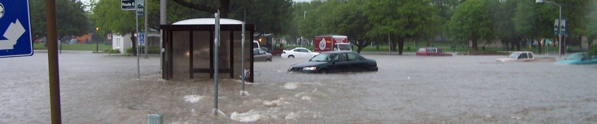 Flooding with cars stuck in high rising water