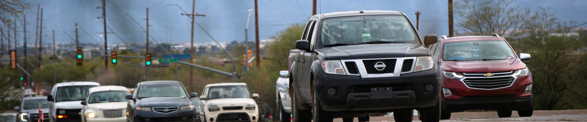 Traffic on Valencia Road with mountains in the background