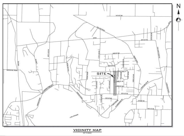 Black-and-white map titled "Vicinity Map" depicts the project area. An arrow with a "Site" callout points to a shaded gray box that spans along 117th Ave NE from 20th St NE to 26th St NE.