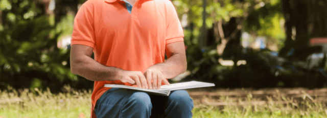 A blind person reading braille