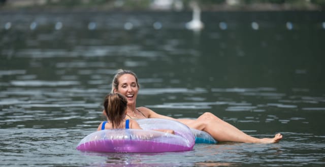 A mom and daughter floating in Shuswap Lake.