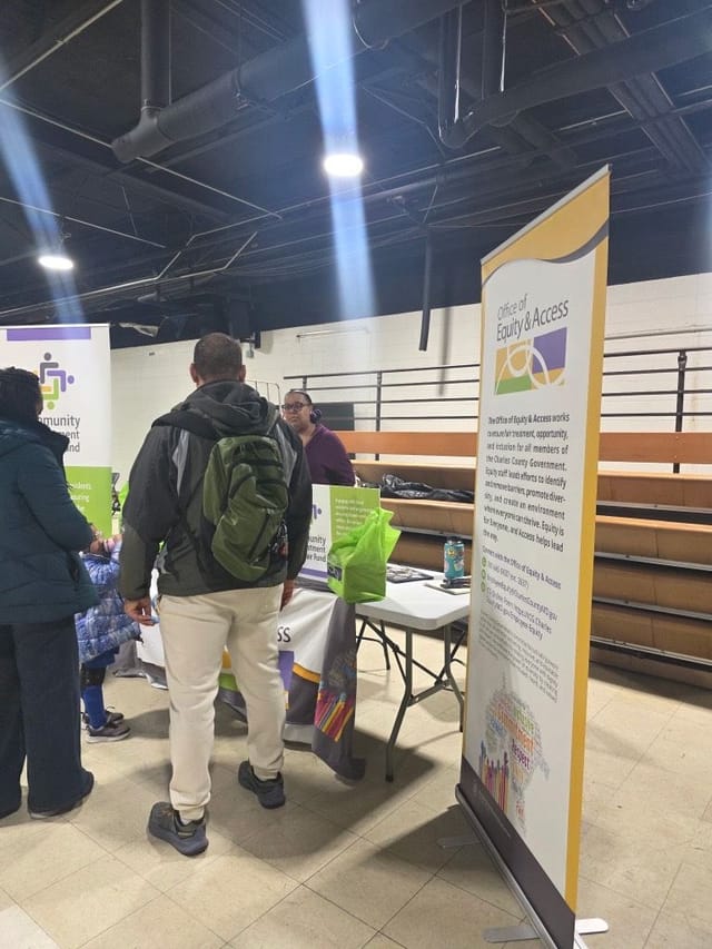 Office of Equity and Access staff sharing information in the community about Community Reinvestment and Repair Fund. 