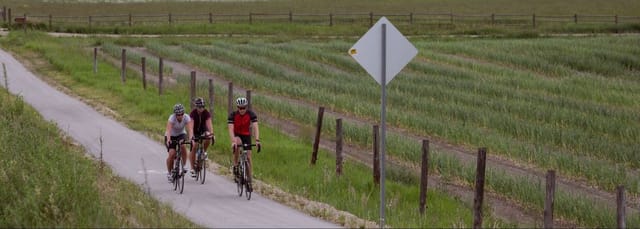 Cyclists on the Salmon River Parallel Trail