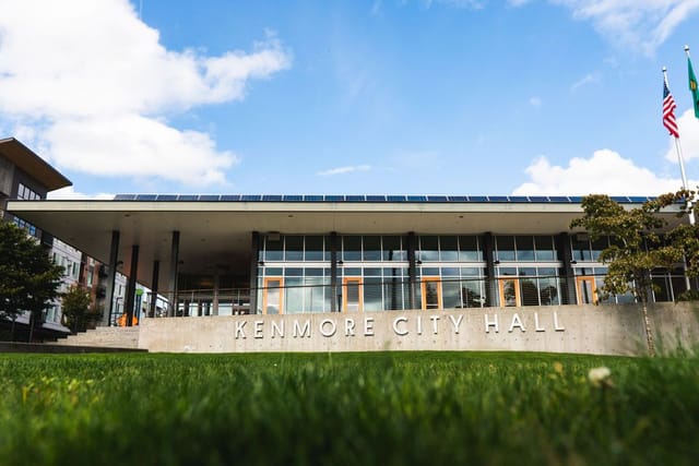 Building with grass in front and blue sky in above