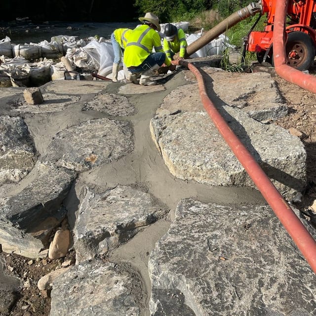 flowable concrete poured to make in-stream feature.