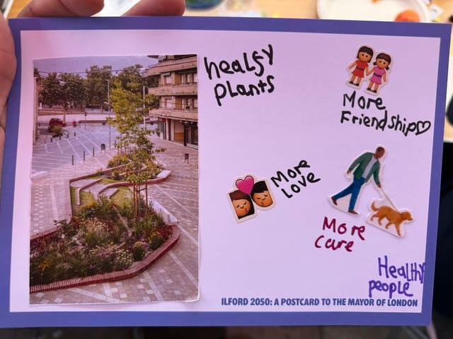 Postcard in children's handwriting. It says healthy plants, more love, more care, more friendships, and healthy people.