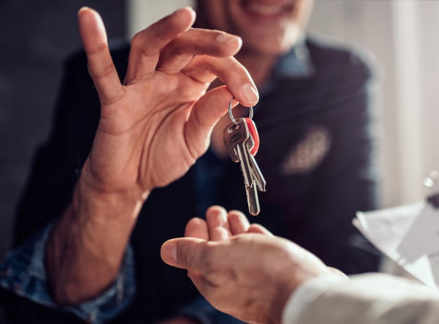 A homeowner giving an accessory dwelling unit renter their keys