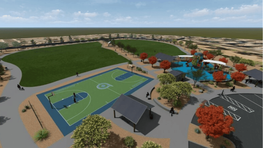 An image from above looking to the east showing the edge of parking, basketball court, play ground, and turf areas.