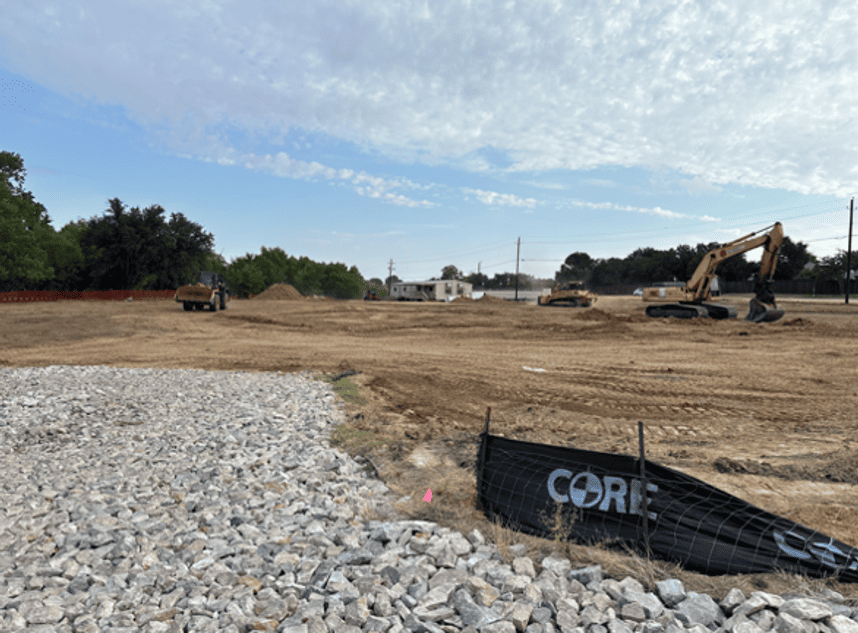 Photo of construction site being cleared with construction crew