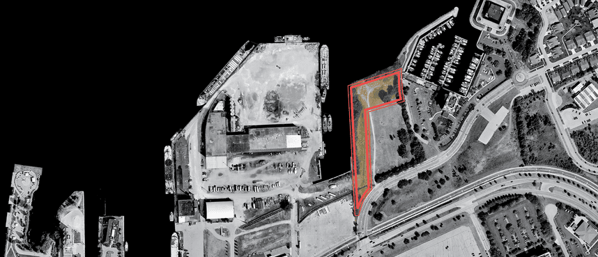 Aerial map showing the proposed 3.12-acre Third Street waterfront park site outlined in red, located along Muskegon Lake near downtown Muskegon. The surrounding area includes the waterfront, marina, roads, parking areas, and nearby properties.