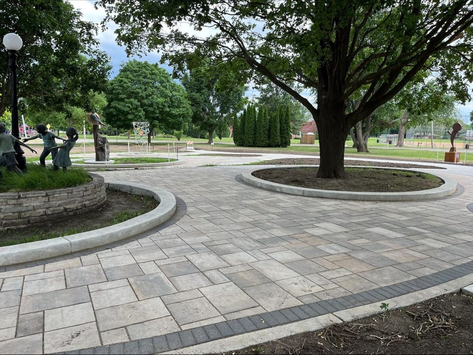 A view of the Sculpture Park with three new sculptures in the background. 