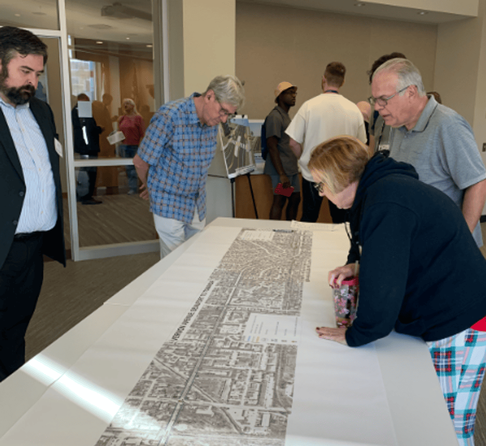 Mayor Chris Koos and Councilmember Karyn Smith review potential improvements to Vernon Avenue at the Aug. 31 open house. 